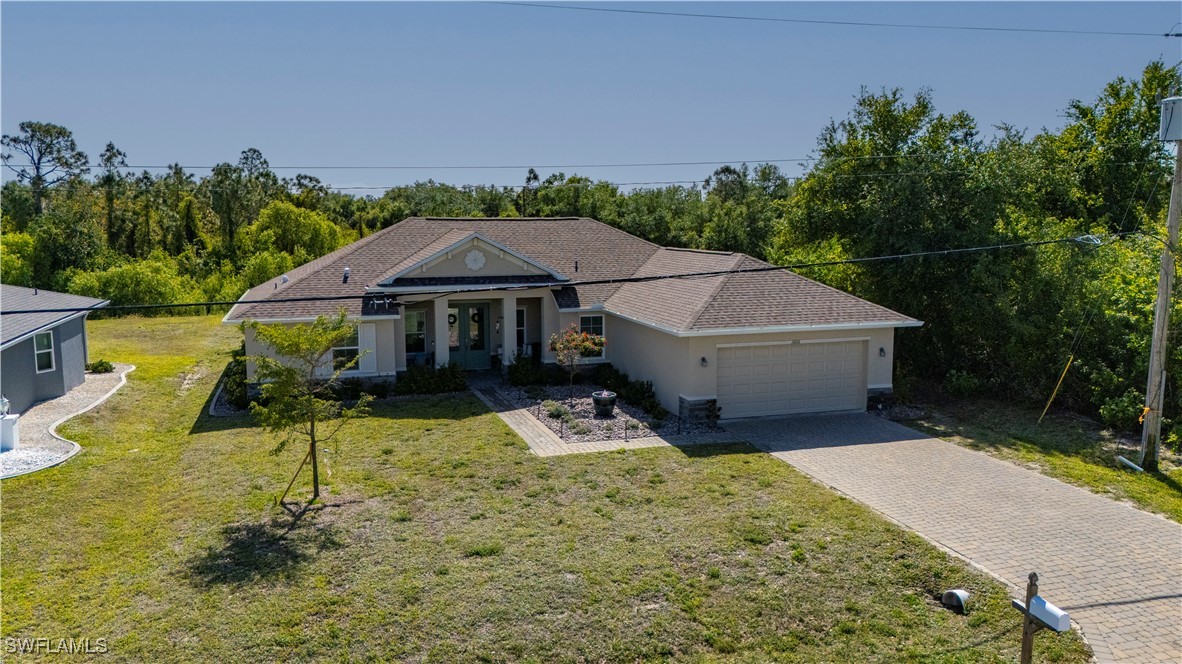 1606 Navigator Road Punta Gorda, FL 33983 - Photo 37 of 47 a house with trees in the background