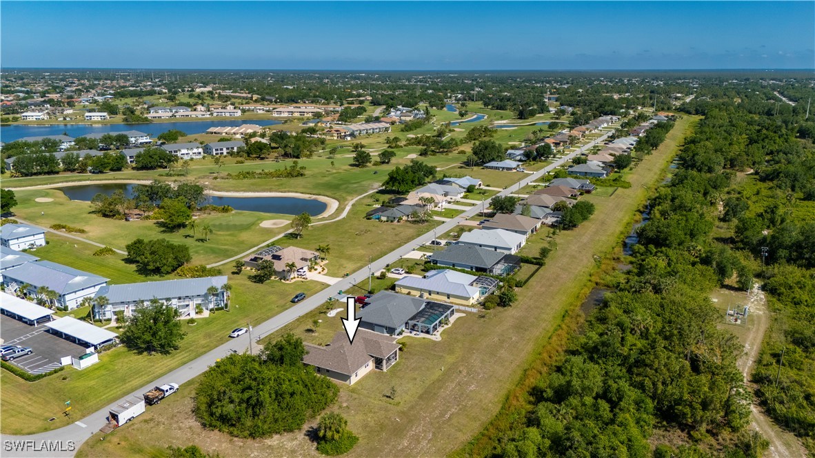 1606 Navigator Road Punta Gorda, FL 33983 - Photo 42 of 47 an aerial view of residential houses with outdoor space and trees