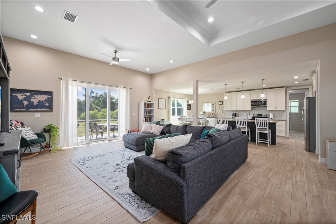 1606 Navigator Road Punta Gorda, FL 33983 - Photo 6 of 47 a living room with furniture and a large window