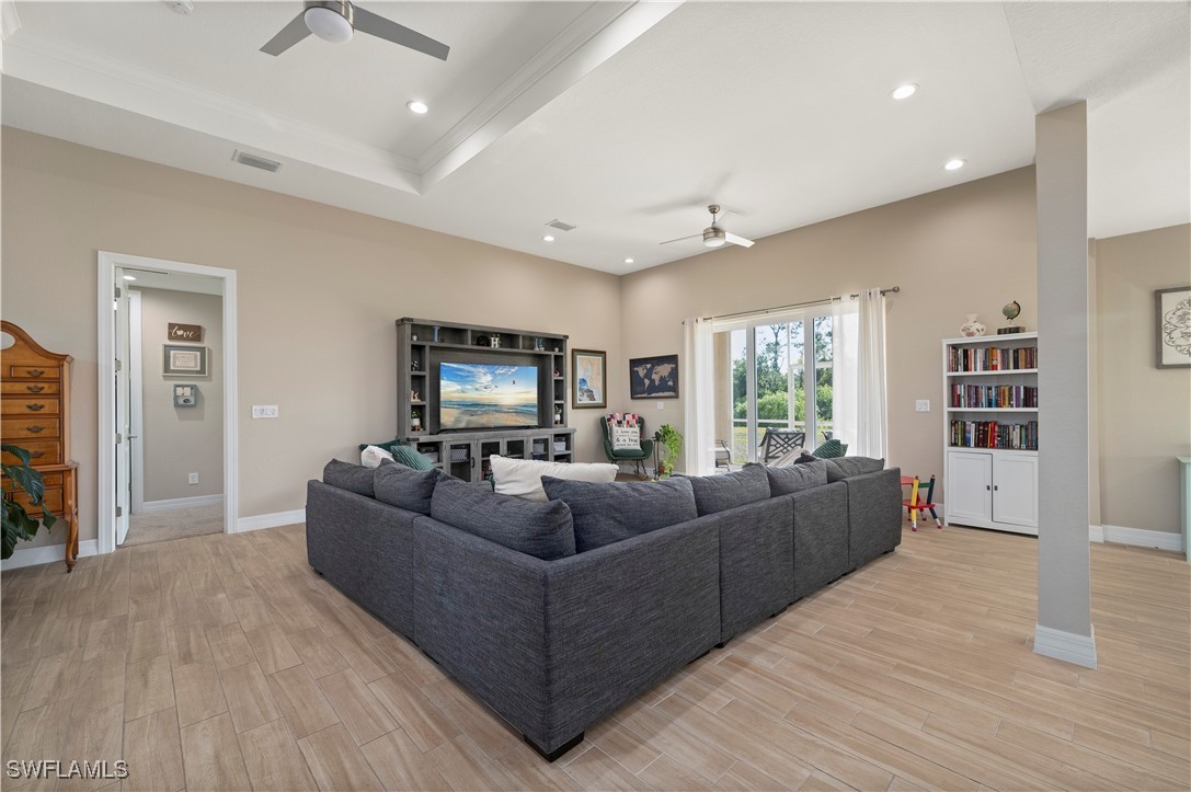 1606 Navigator Road Punta Gorda, FL 33983 - Photo 7 of 47 a living room with furniture and a flat screen tv