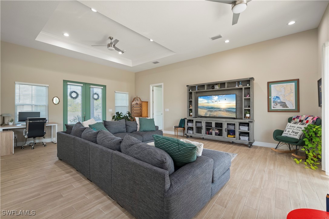 1606 Navigator Road Punta Gorda, FL 33983 - Photo 8 of 47 a living room with furniture and a flat screen tv