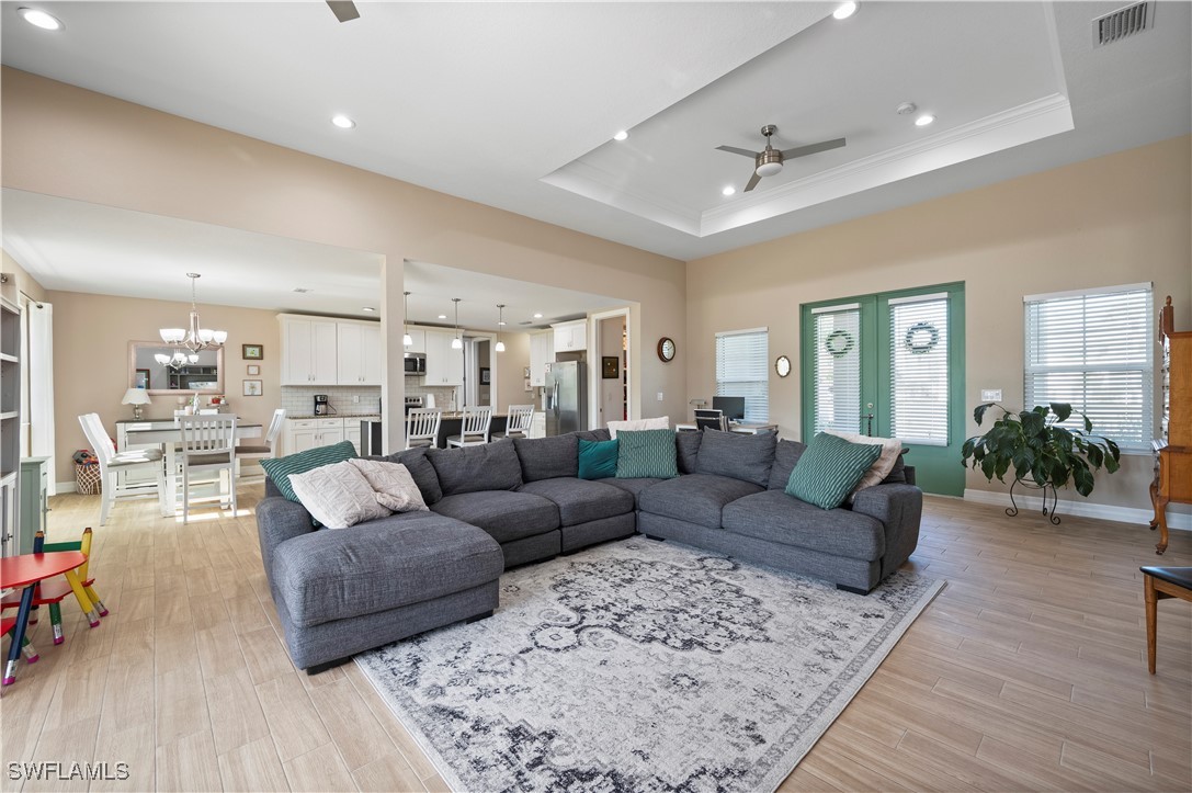 1606 Navigator Road Punta Gorda, FL 33983 - Photo 9 of 47 a living room with furniture and wooden floor