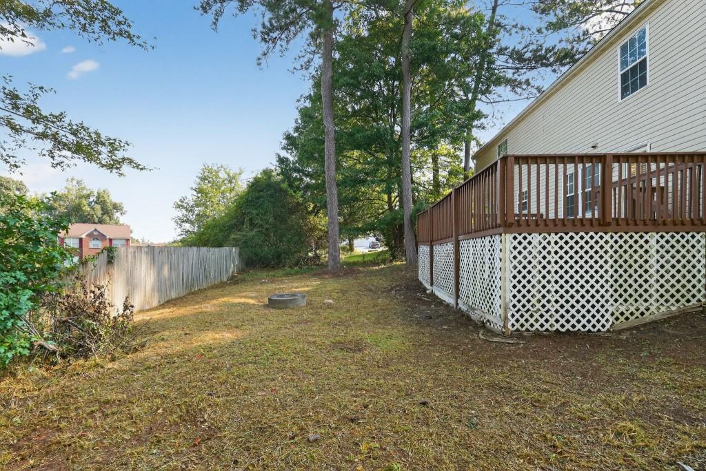 3737 Waldrop Road Decatur, GA 30034 - Photo 11 of 28 a view of a yard with a trees and wooden fence
