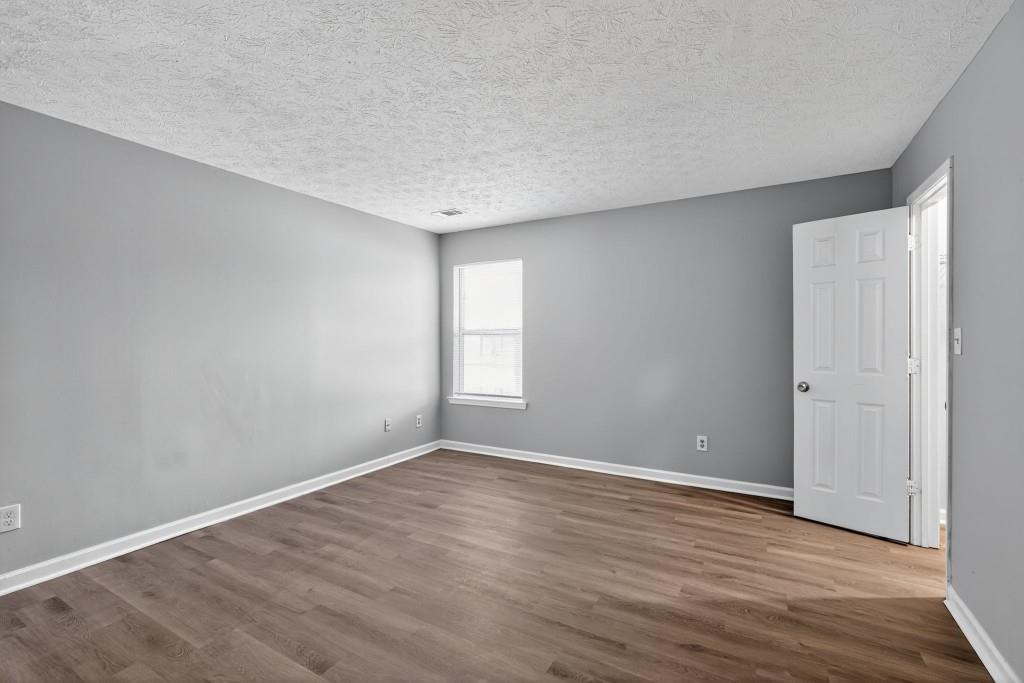 3737 Waldrop Road Decatur, GA 30034 - Photo 14 of 28 a view of an empty room with wooden floor and window