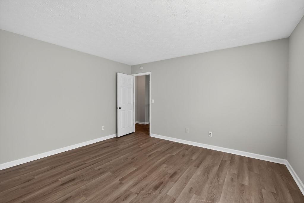 3737 Waldrop Road Decatur, GA 30034 - Photo 17 of 28 a view of an empty room with wooden floor