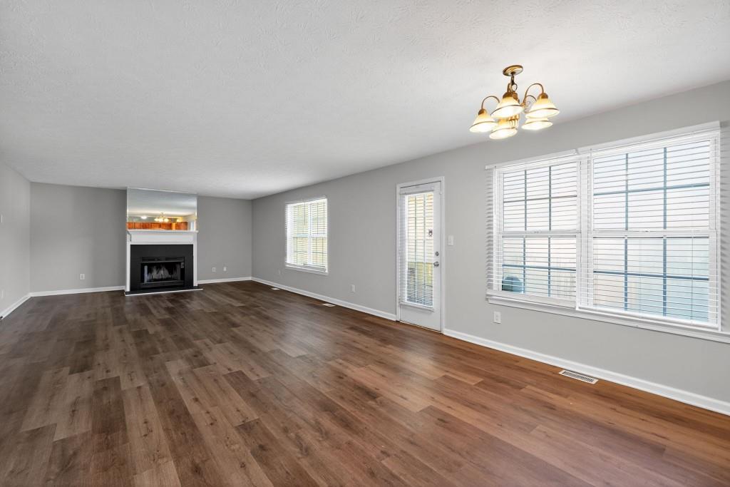 3737 Waldrop Road Decatur, GA 30034 - Photo 20 of 28 a view of an empty room with a window and wooden floor