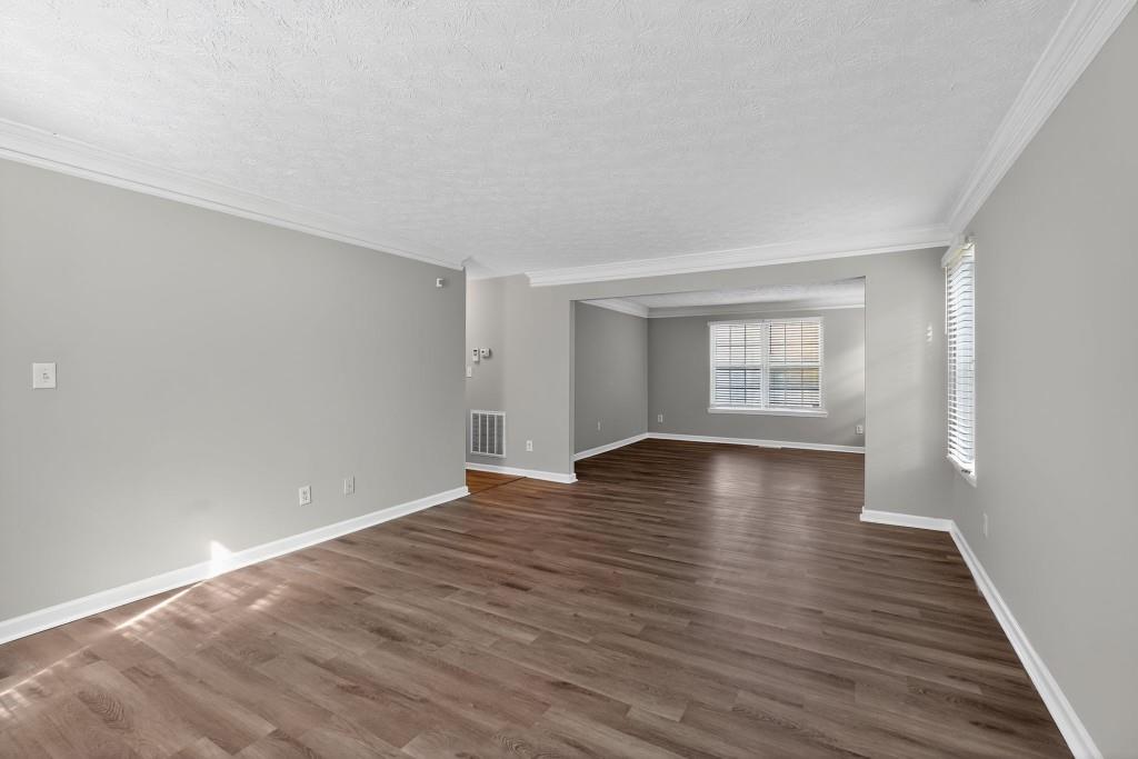 3737 Waldrop Road Decatur, GA 30034 - Photo 22 of 28 a view of an empty room with wooden floor and window