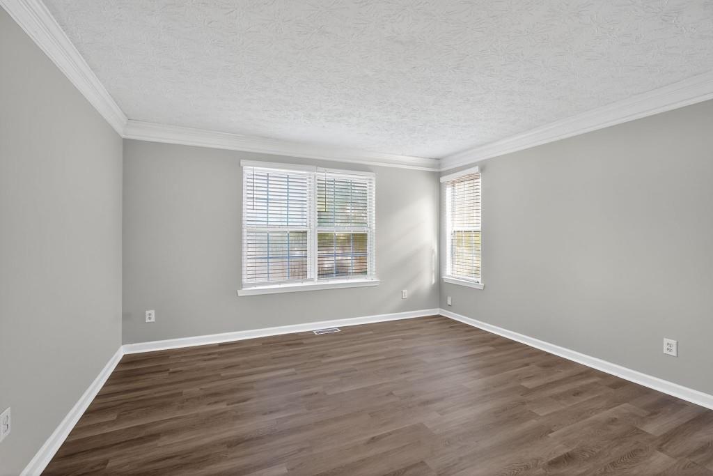 3737 Waldrop Road Decatur, GA 30034 - Photo 25 of 28 a view of an empty room with wooden floor and a window