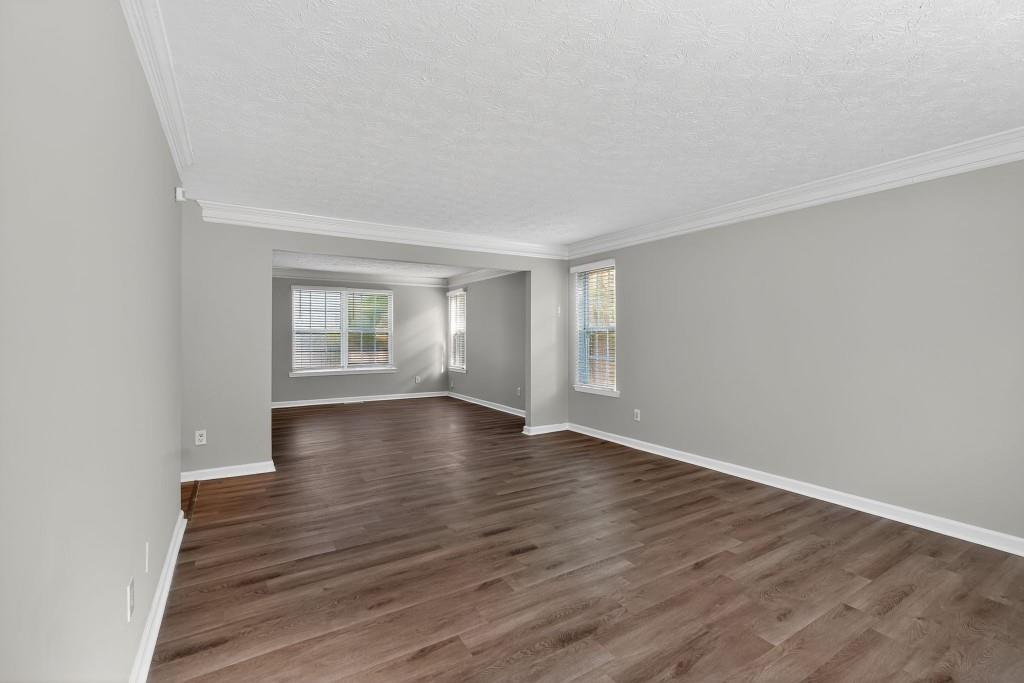 3737 Waldrop Road Decatur, GA 30034 - Photo 26 of 28 wooden floor in an empty room with a window
