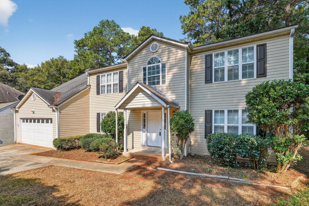 3737 Waldrop Road Decatur, GA 30034 - Photo 3 of 28 a front view of a house with a yard and potted plants