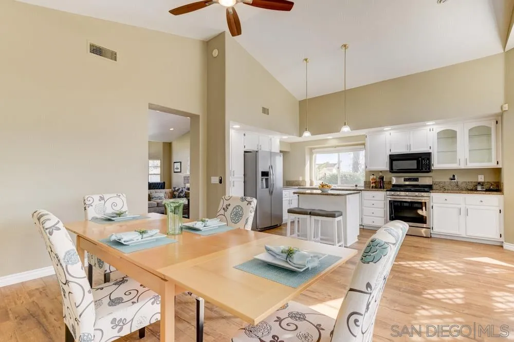 2762 Jody Place Escondido, CA 92027 - Photo 11 of 25 a large kitchen with a table and chairs