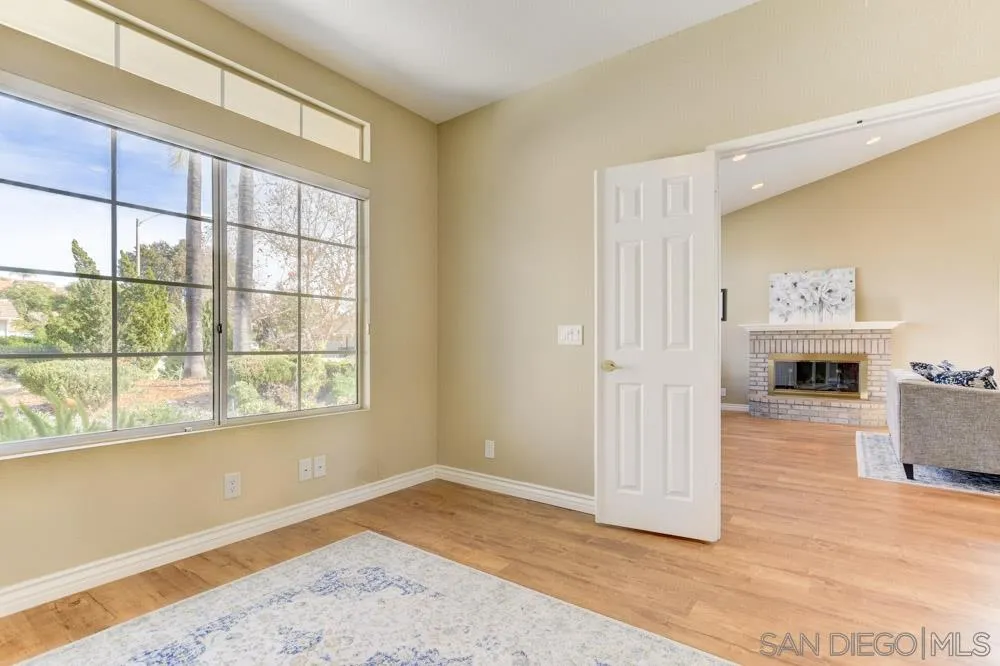 2762 Jody Place Escondido, CA 92027 - Photo 13 of 25 a view of empty room with wooden floor and fan