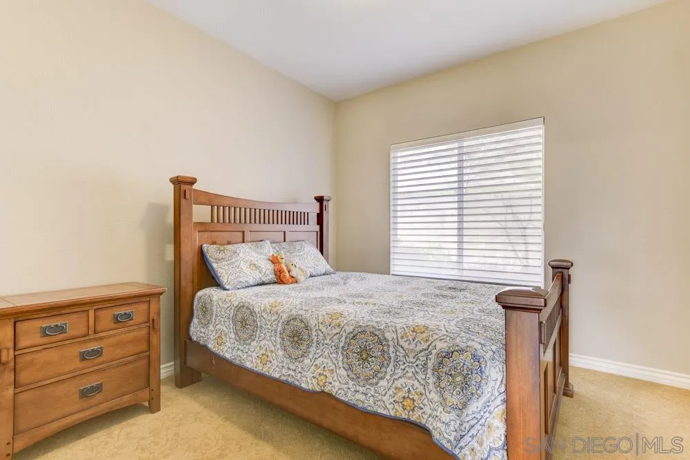 2762 Jody Place Escondido, CA 92027 - Photo 14 of 25 a bedroom with a bed and a window