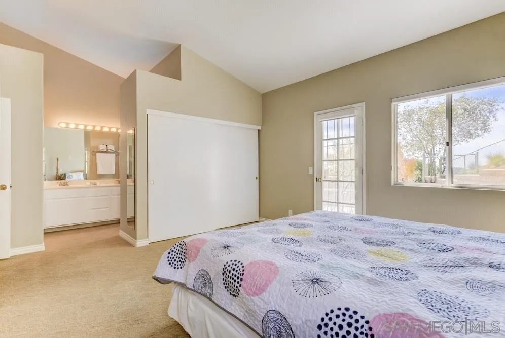 2762 Jody Place Escondido, CA 92027 - Photo 16 of 25 a bedroom with a bed and a window
