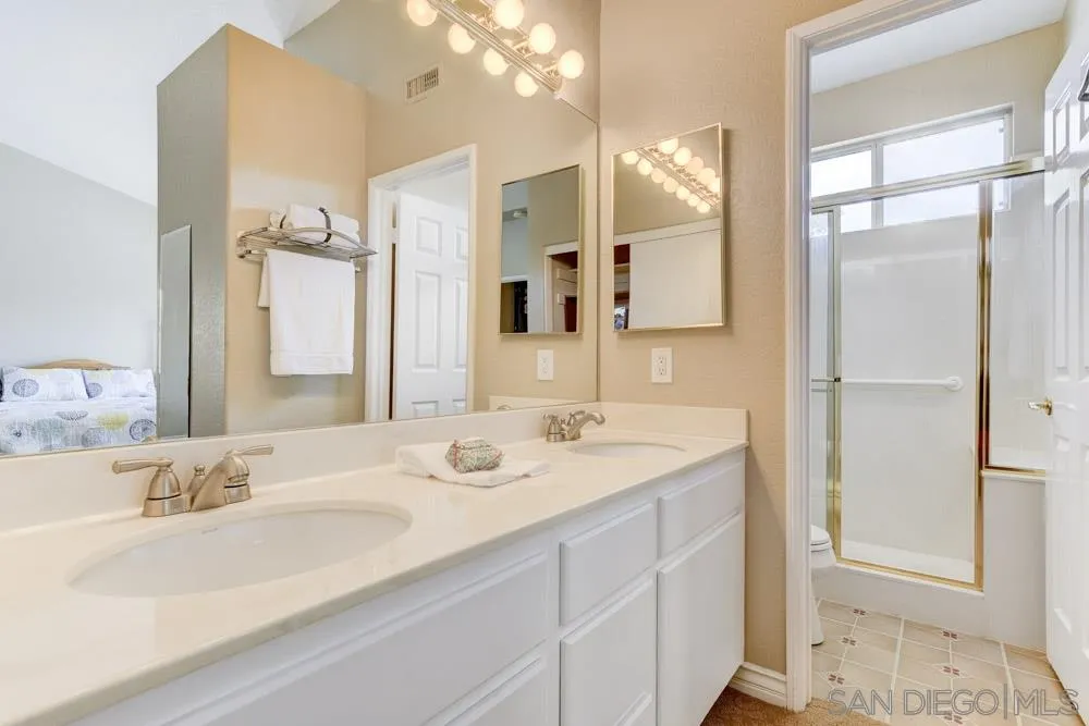 2762 Jody Place Escondido, CA 92027 - Photo 18 of 25 a bathroom with a sink double vanity and a mirror