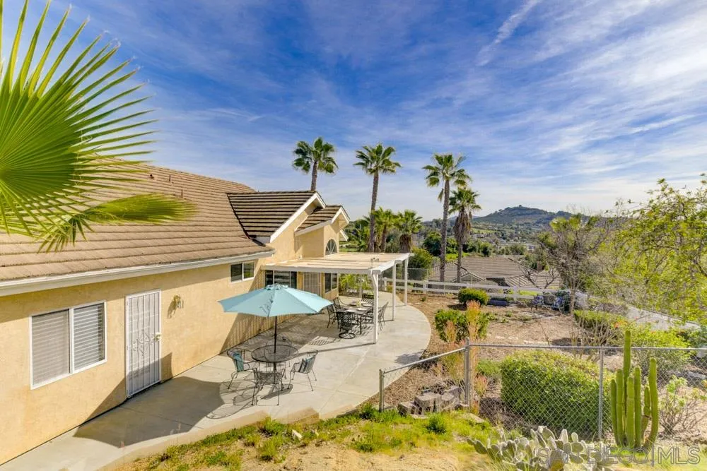 2762 Jody Place Escondido, CA 92027 - Photo 20 of 25 a view of a swimming pool with an outdoor seating