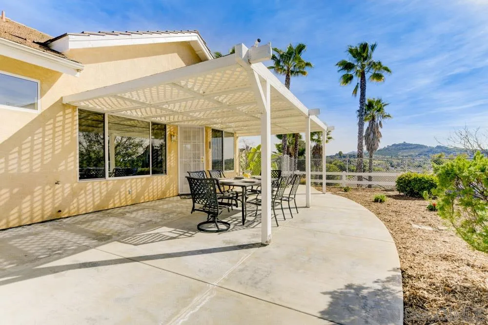 2762 Jody Place Escondido, CA 92027 - Photo 23 of 25 a view of a house with backyard porch and sitting area