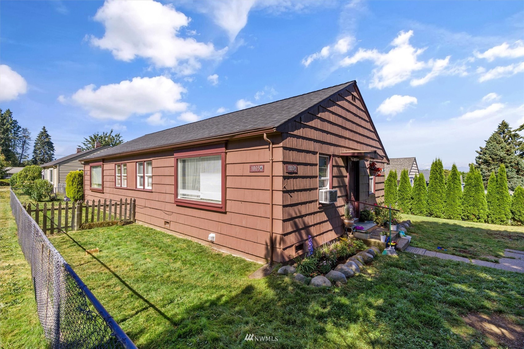 a front view of a house with garden