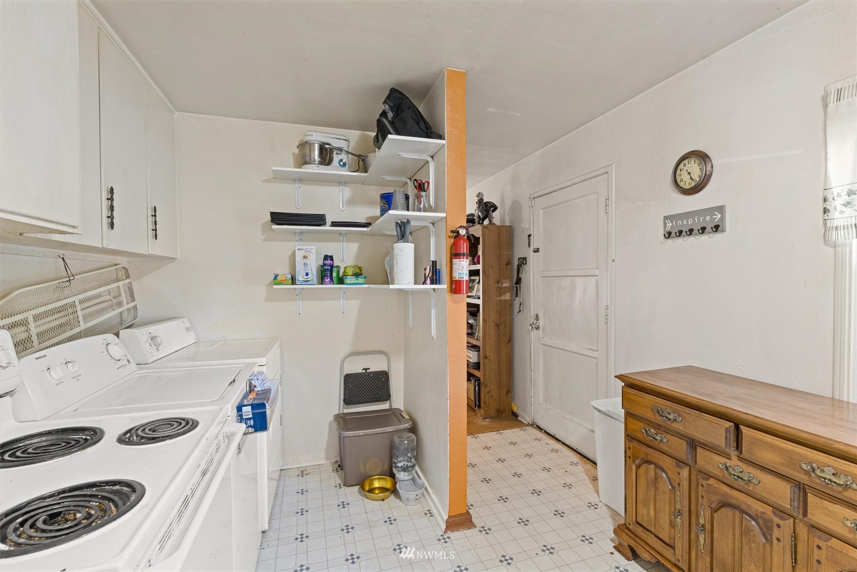 1005 Lane Place, Unit A&B Everett, WA 98203 - Photo 19 of 31 a room with a refrigerator and a stove