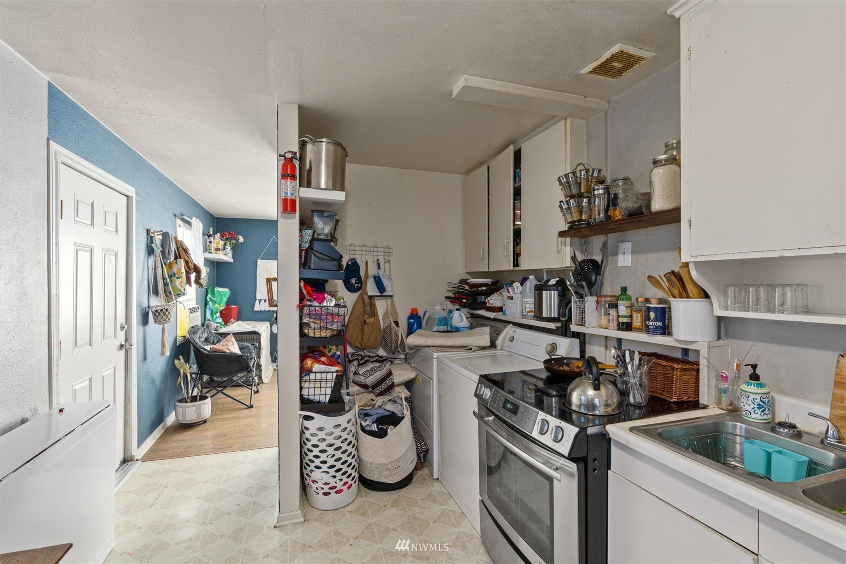 1005 Lane Place, Unit A&B Everett, WA 98203 - Photo 7 of 31 a view of a kitchen with appliances and cabinets