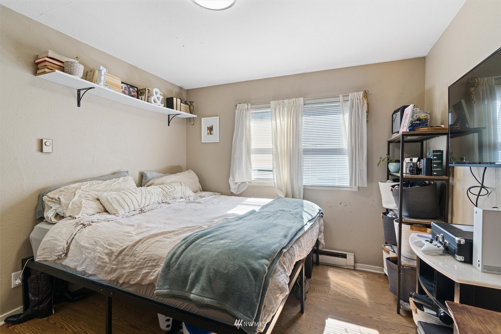 1005 Lane Place, Unit A&B Everett, WA 98203 - Photo 9 of 31 a bedroom with a bed and a flat screen tv