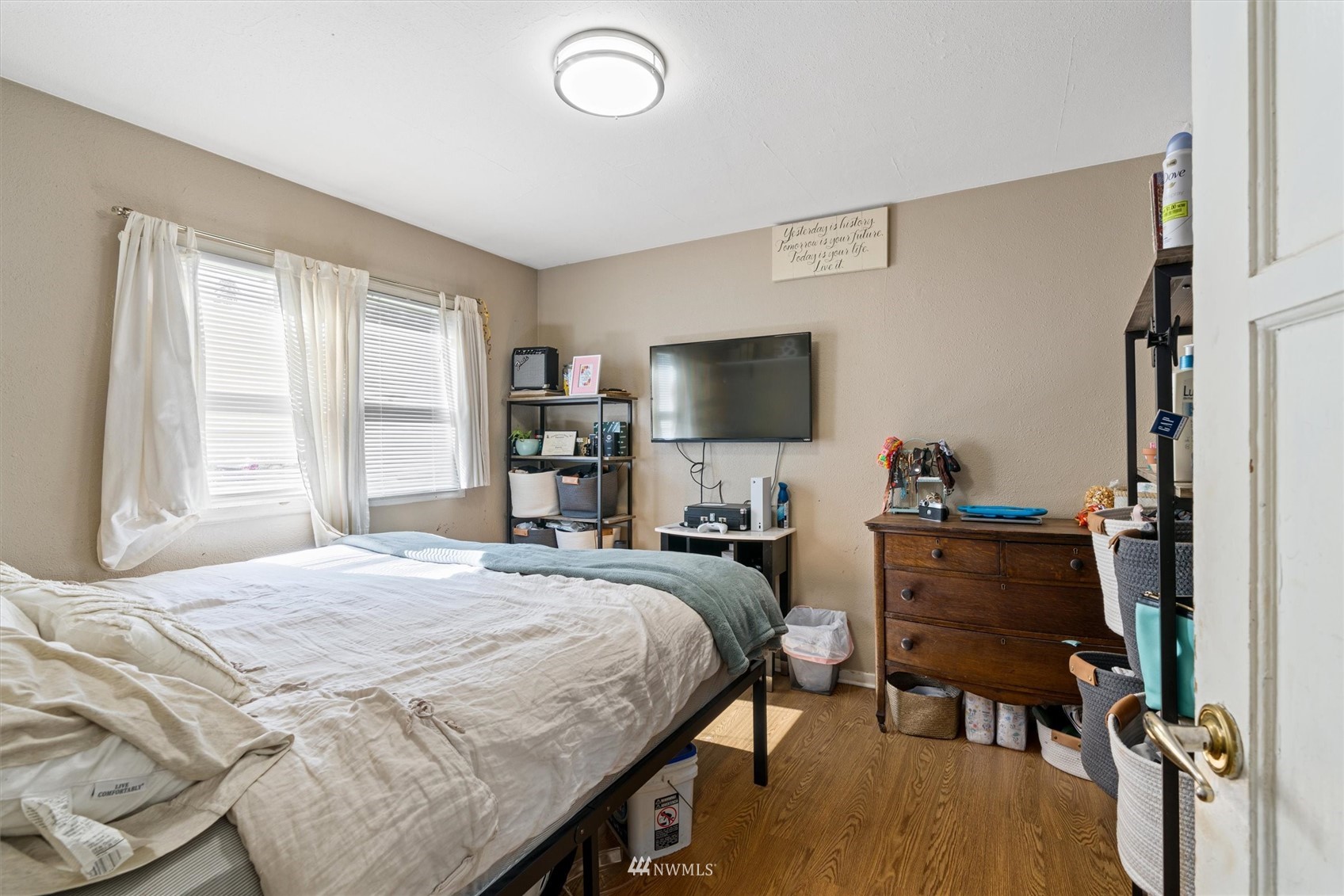 1005 Lane Place, Unit A&B Everett, WA 98203 - Photo 10 of 31 a bedroom with a bed and a flat screen tv