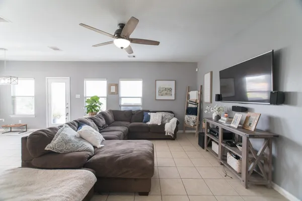 a living room with furniture and a flat screen tv