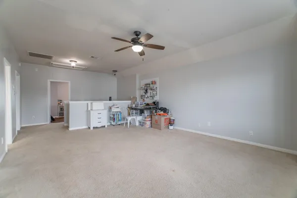 a view of a livingroom with natural light