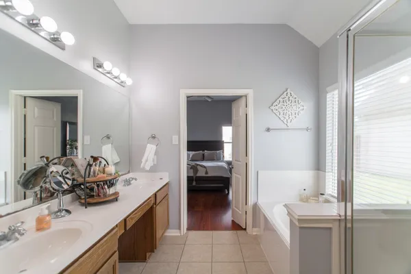 a en suite bathroom with a sink double vanity