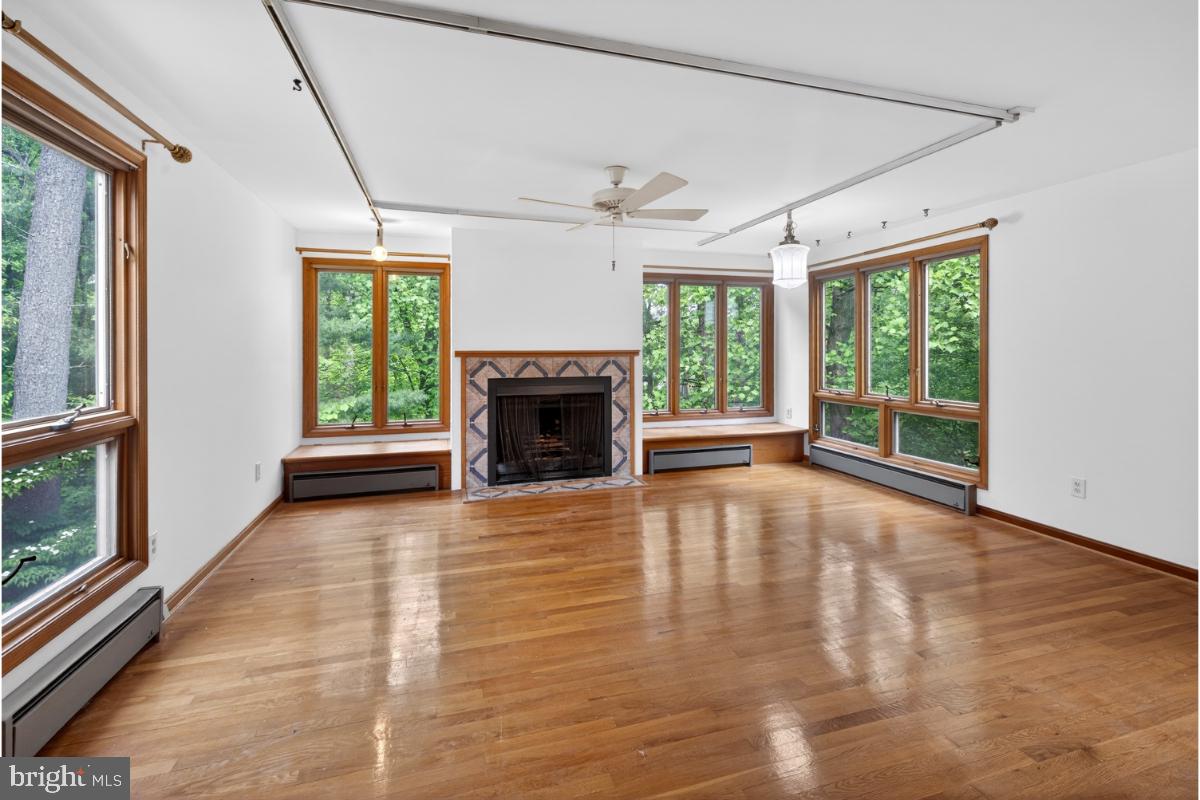 4068 Adams Drive Silver Spring, MD 20902 - Photo 26 of 43 a view of an empty room with a fireplace and a window