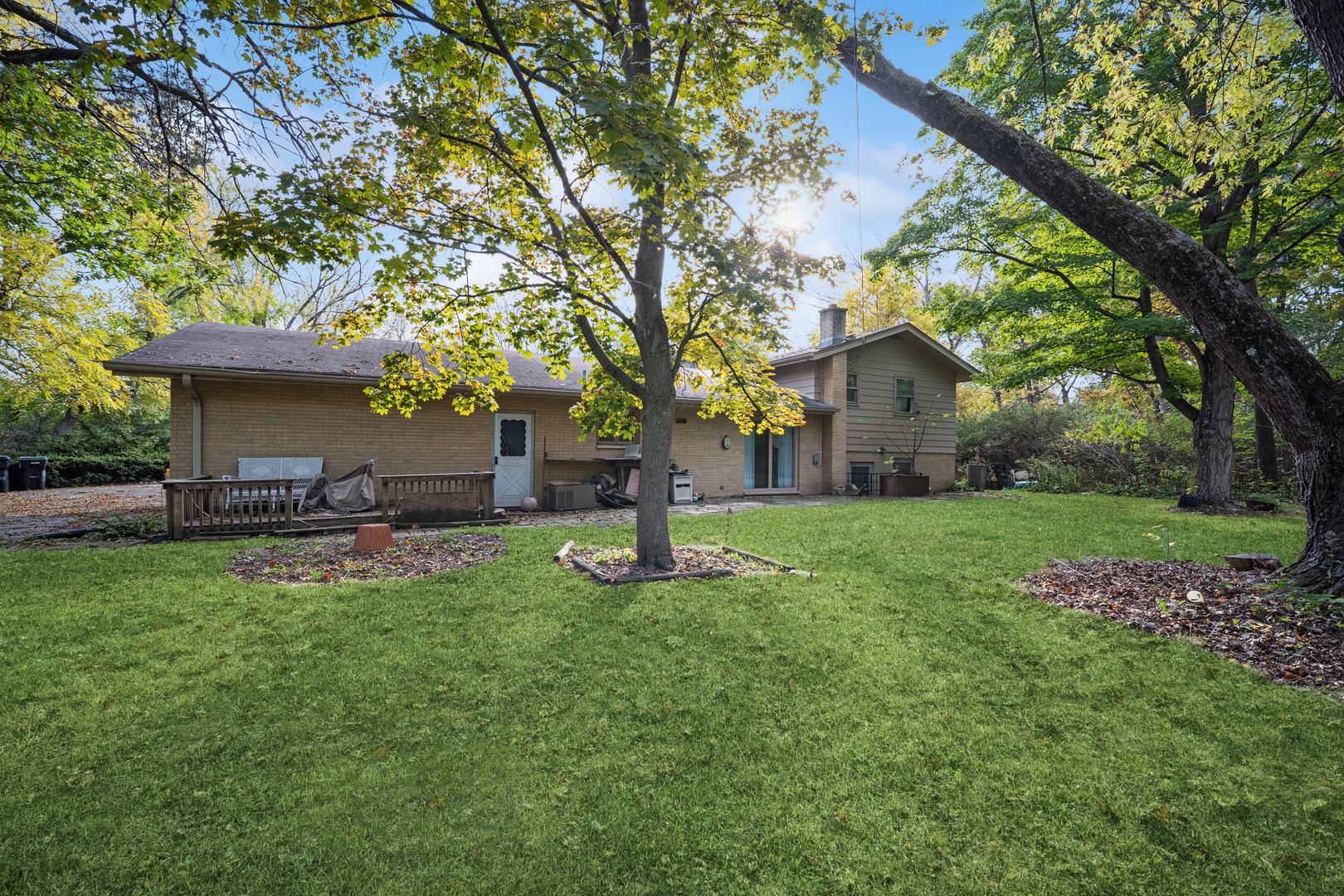 1068 North Hainesville Road Round Lake, IL 60073 - Photo 22 of 31 a view of a house with backyard sitting area and garden