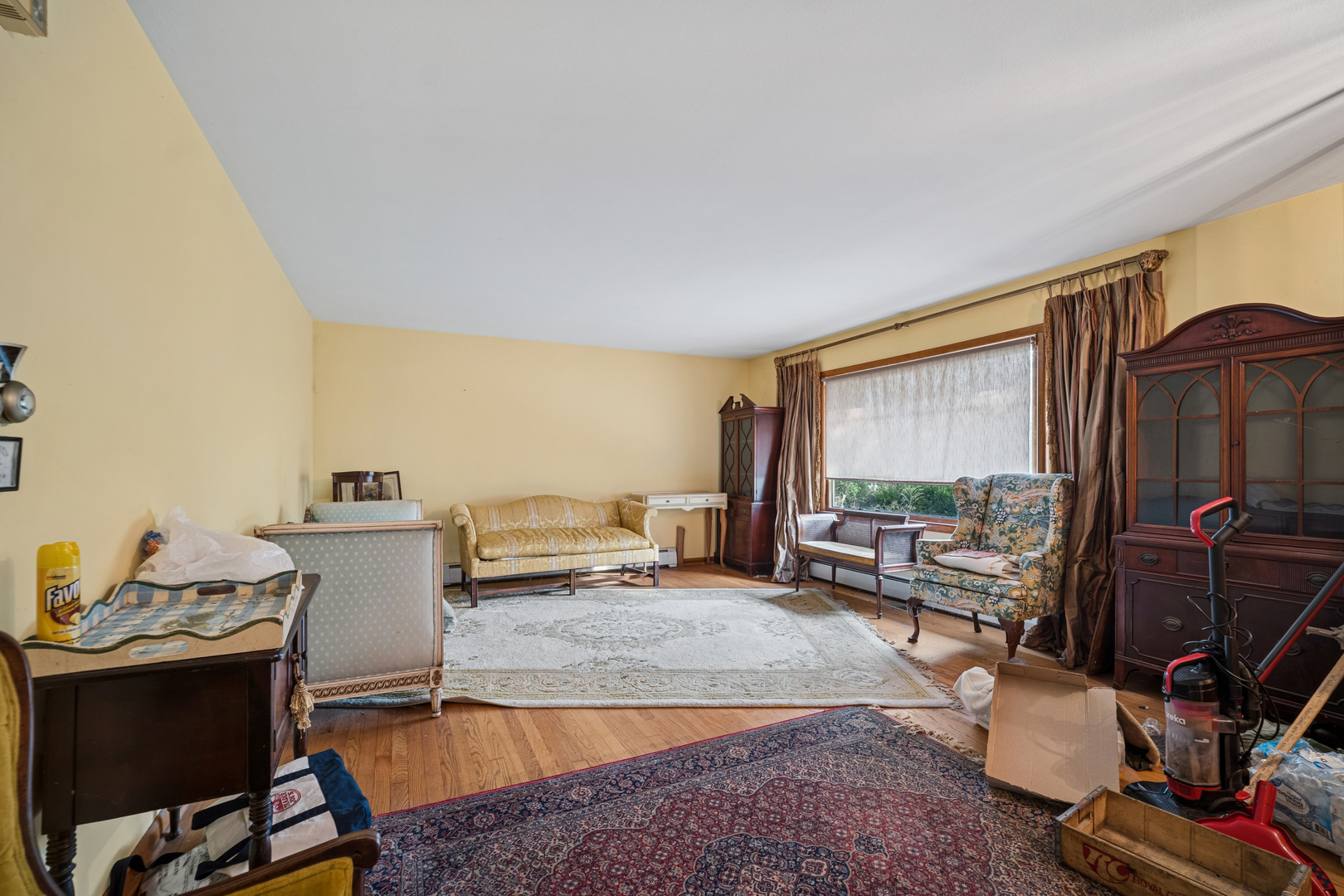1068 North Hainesville Road Round Lake, IL 60073 - Photo 5 of 31 a living room with furniture a large window and a flat screen tv