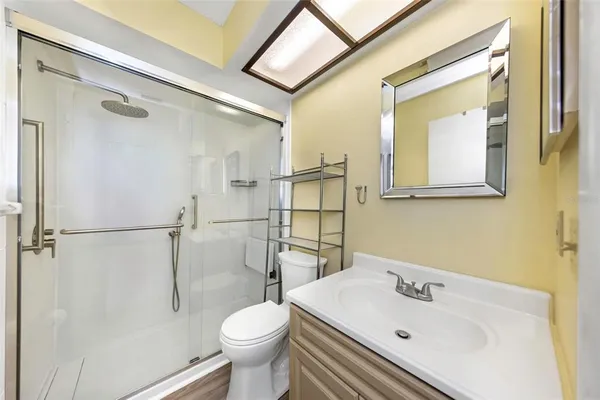 a bathroom with a sink toilet and shower
