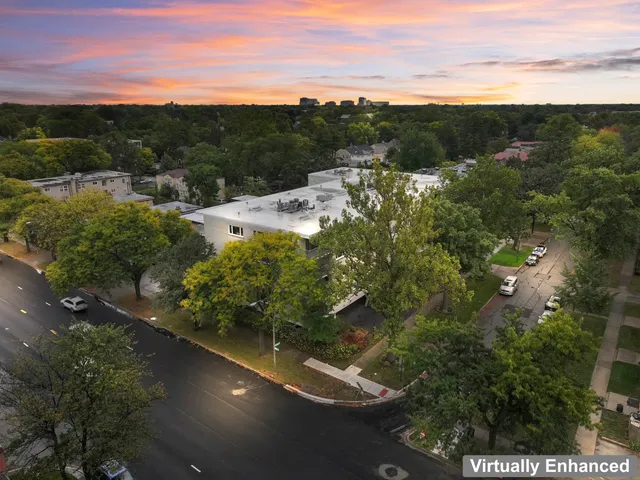 a view of a garden with a street