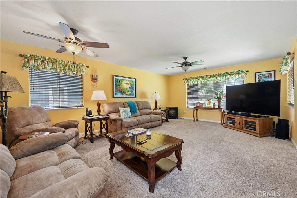 18650 Horseshoe Road Hidden Valley Lake, CA 95467 - Photo 11 of 26 a living room with furniture and a flat screen tv