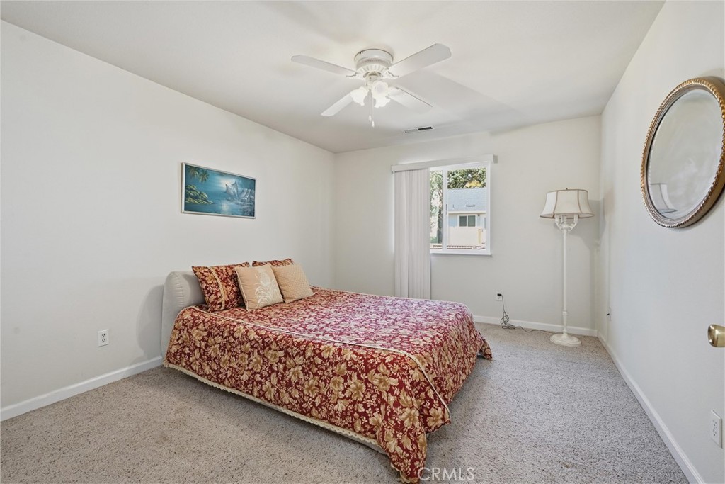 18650 Horseshoe Road Hidden Valley Lake, CA 95467 - Photo 13 of 26 a bedroom with a bed and a chandelier