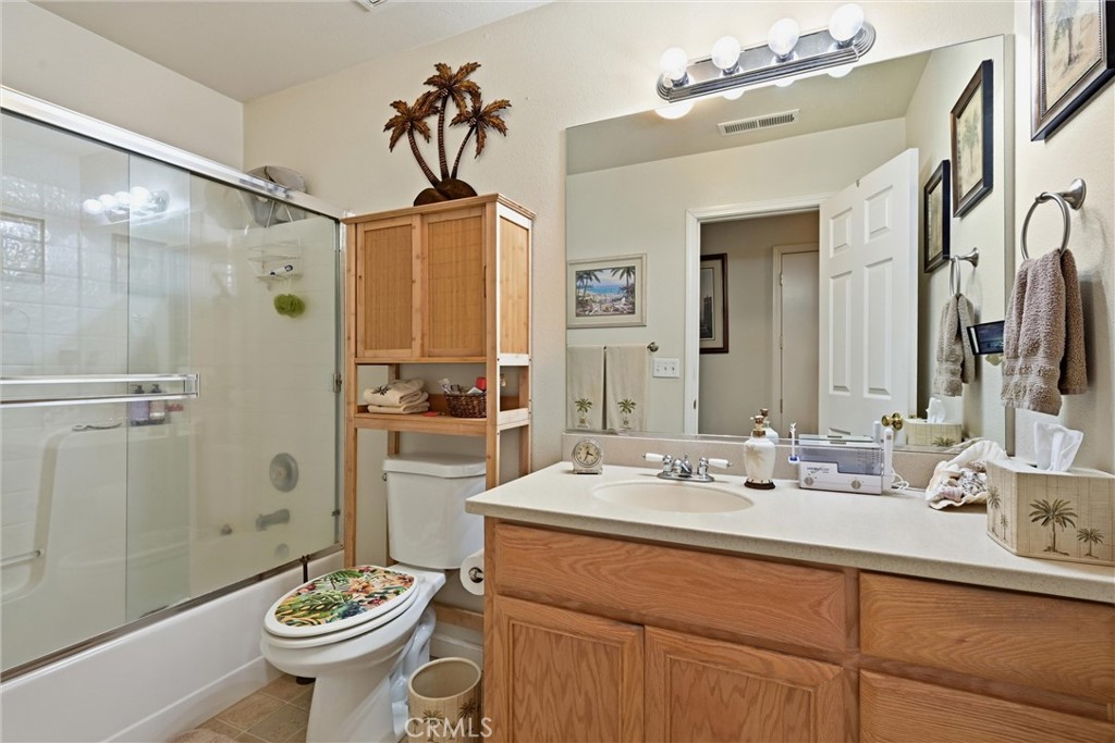 18650 Horseshoe Road Hidden Valley Lake, CA 95467 - Photo 14 of 26 a bathroom with a sink toilet and shower