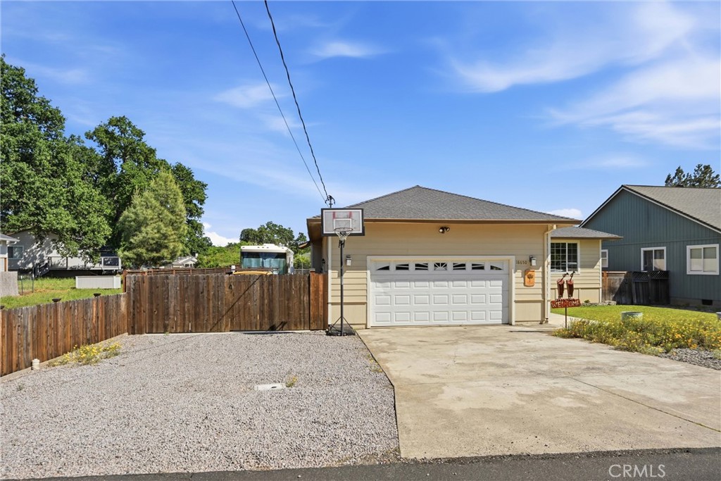 18650 Horseshoe Road Hidden Valley Lake, CA 95467 - Photo 2 of 26 a front view of a house with a yard