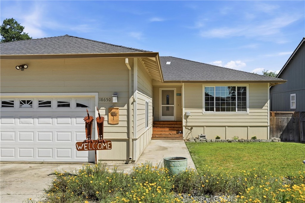 18650 Horseshoe Road Hidden Valley Lake, CA 95467 - Photo 4 of 26 a front view of a house with garden