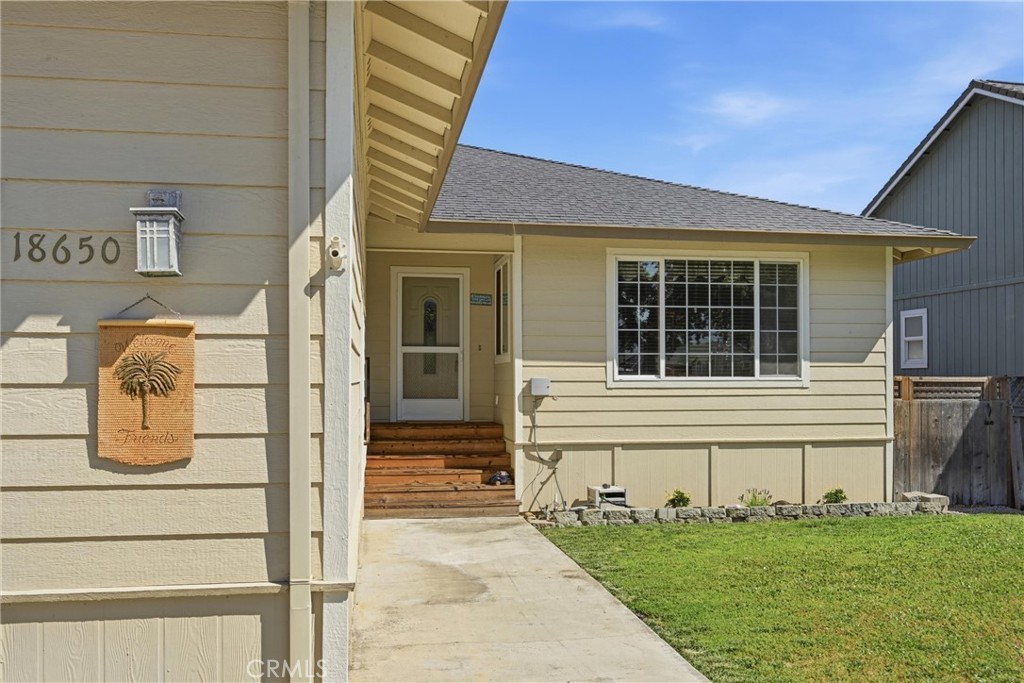 18650 Horseshoe Road Hidden Valley Lake, CA 95467 - Photo 5 of 26 a front view of a house with a garden
