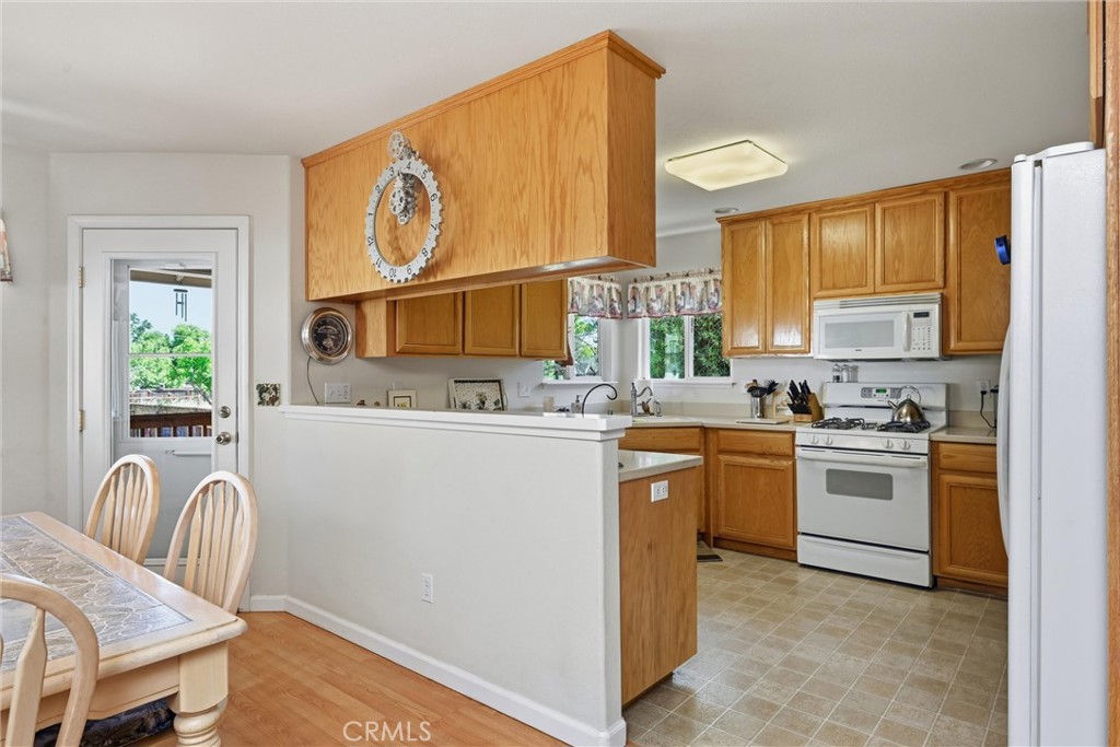 18650 Horseshoe Road Hidden Valley Lake, CA 95467 - Photo 7 of 26 a kitchen with a sink cabinets and window