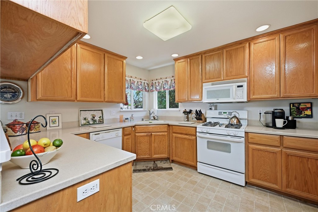 18650 Horseshoe Road Hidden Valley Lake, CA 95467 - Photo 8 of 26 a kitchen with stainless steel appliances granite countertop a sink a stove and cabinets