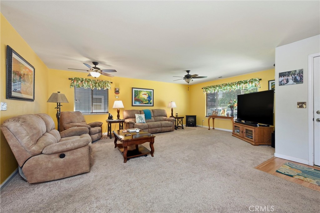 18650 Horseshoe Road Hidden Valley Lake, CA 95467 - Photo 10 of 26 a living room with furniture and a flat screen tv