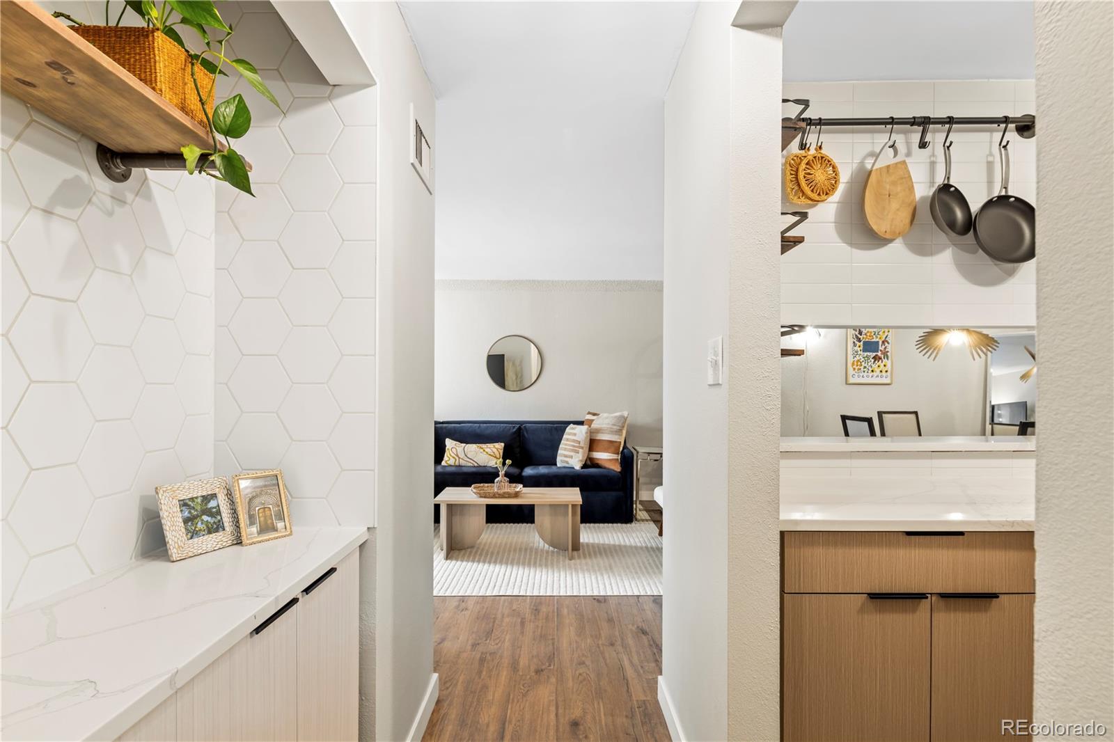 2 Adams Street, Unit 108 Denver, CO 80206 - Photo 16 of 36 a view of living room with furniture and wooden floor