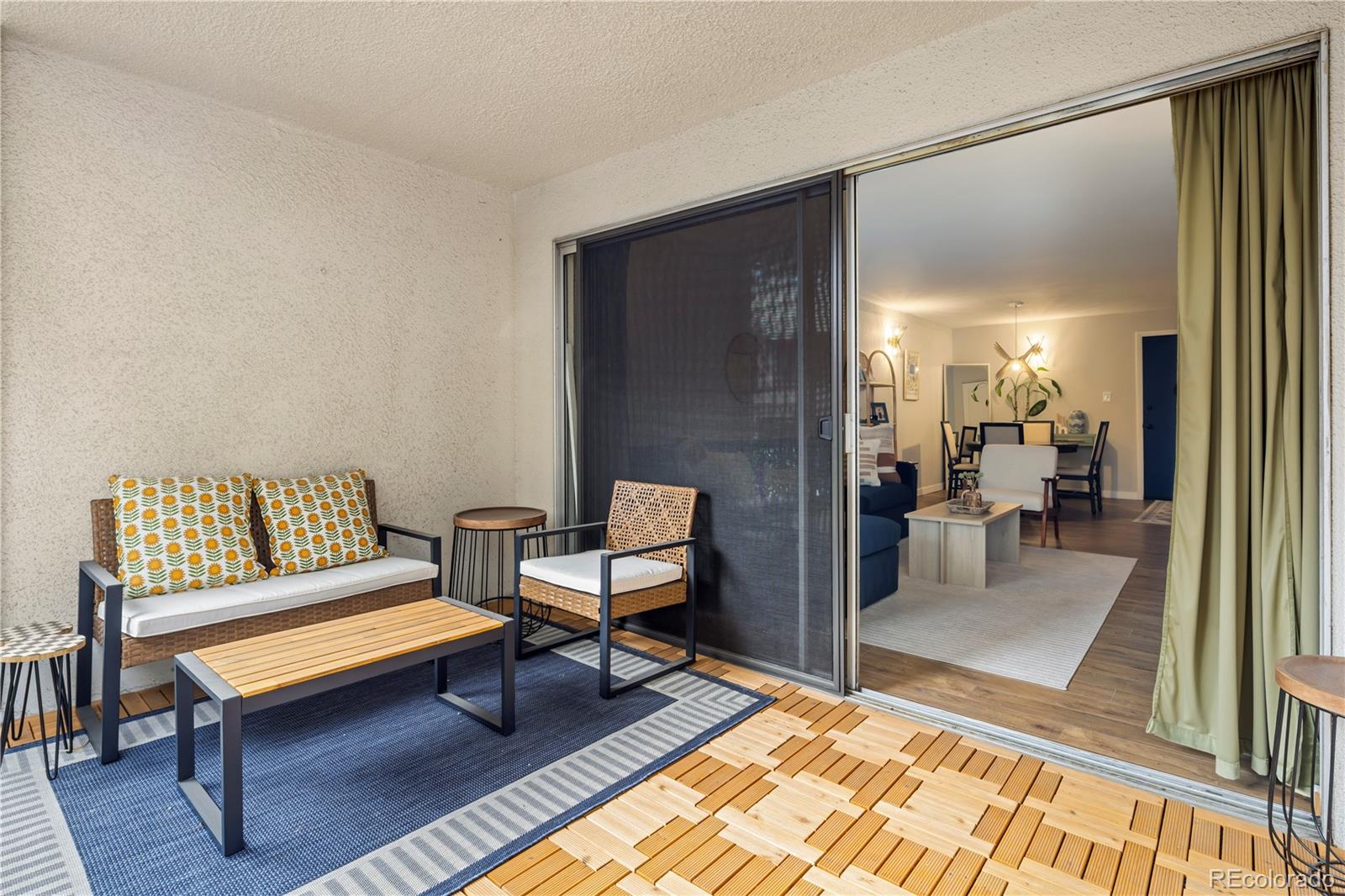 2 Adams Street, Unit 108 Denver, CO 80206 - Photo 9 of 36 a bedroom with furniture and a rug