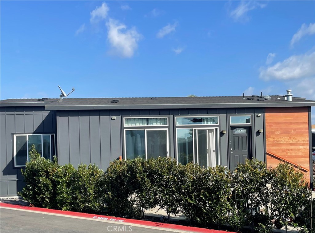 283 Cambridge Way Newport Beach, CA 92660 - Photo 2 of 33 front view of house with potted plants