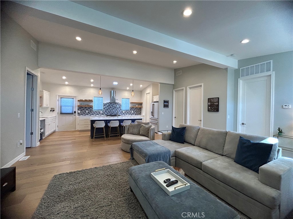 283 Cambridge Way Newport Beach, CA 92660 - Photo 3 of 33 a living room with furniture and a view of kitchen