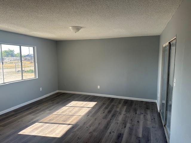 5558 Lake Alpaugh Ca Alpaugh, CA 93201 - Photo 3 of 14 an empty room with wooden floor and windows