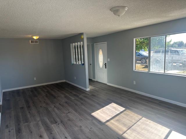 5558 Lake Alpaugh Ca Alpaugh, CA 93201 - Photo 5 of 14 a view of wooden floor and windows in a room
