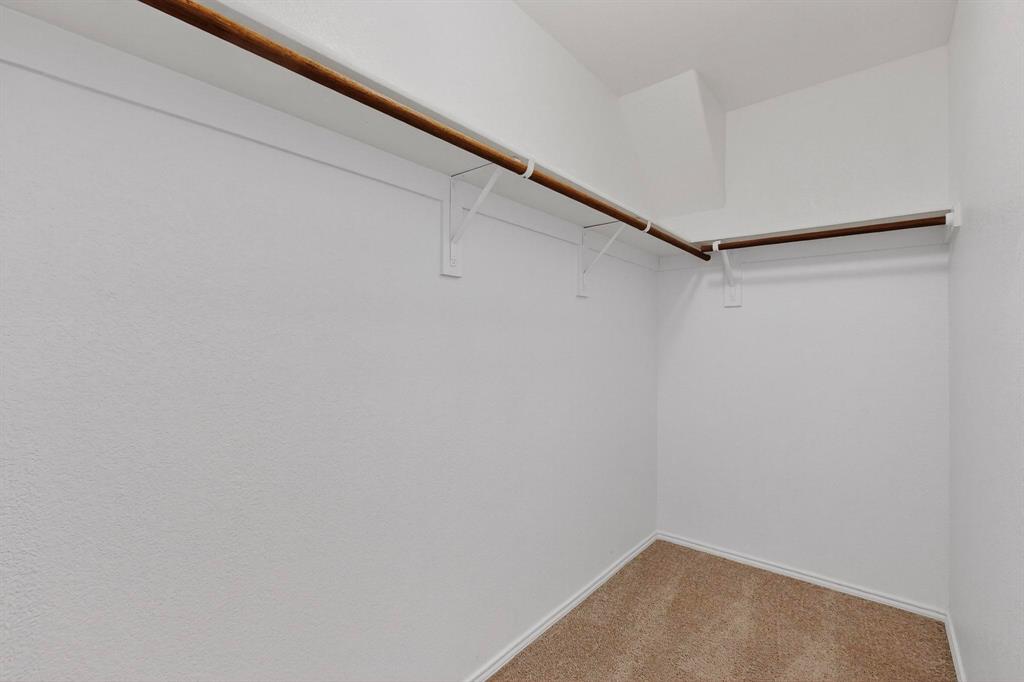 5516 McClelland Street Forney, TX 75126 - Photo 25 of 36 Walk in closet with carpet flooring